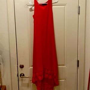 Long red high low dress with embroidered bottom